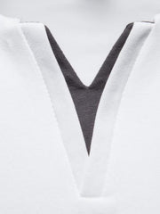 White cotton tee with notched dark gray V-neck detail