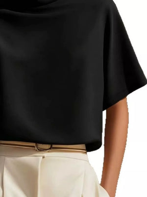 Black mock neck t-shirt with relaxed sleeves in polyester, styled with a belt.