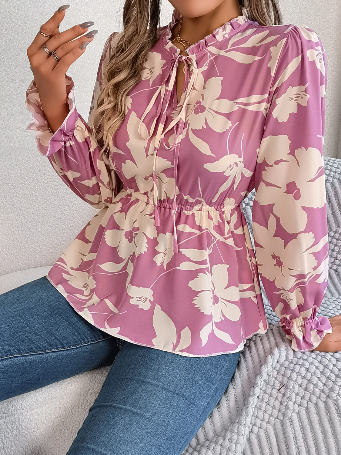 Pink purple floral peplum blouse with ruffled neck and tie detail