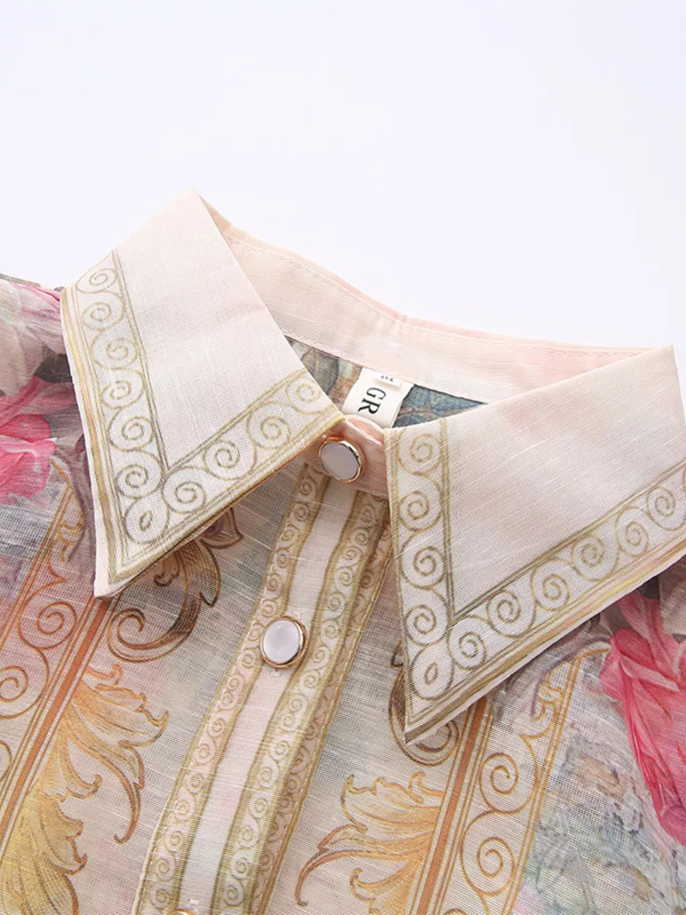 Pastel floral print button-down shirt dress with ornate collar and button details.