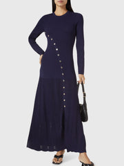 Dark blue ribbed knit maxi dress with decorative buttons and a side slit.