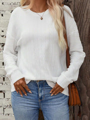 White textured chevron knit crewneck sweater with long sleeves.