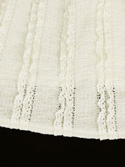 White cami top with vertical textured stripes and lace trim detail