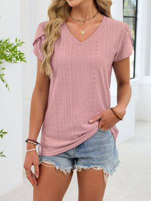 Blush pink eyelet v-neck tee with petal sleeves and textured pattern.