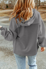 Textured utility hoodie jacket in gray with contrast panel and hood.