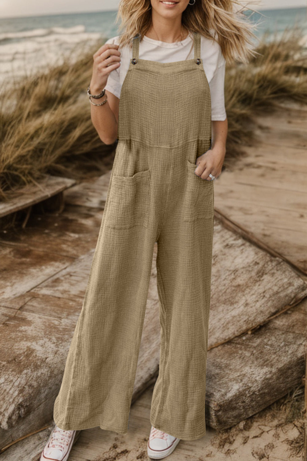Textured cotton overalls in camel with square pockets and wide legs.