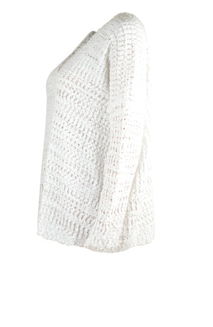 White asymmetric slouch knit sweater with open shoulder detail and textured acrylic fabric.