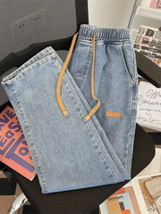 Light blue wide-leg jeans with drawstring and elastic waist.