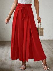 Red paperbag waist palazzo pants with side slits and tie detail