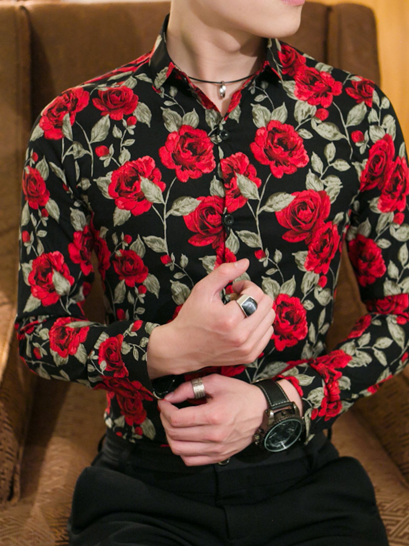 Black floral print cotton blend button-down shirt with red roses and green leaves.