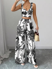 Black and white tropical print crop top and wide-leg pants set with tie straps and smocked waist.