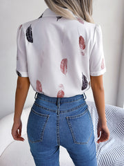 White feather print collared puff sleeve blouse with a casual fit.