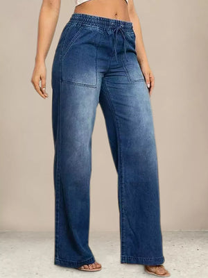 Maternity wide leg jeans in light blue denim with drawstring waist and patch pockets.