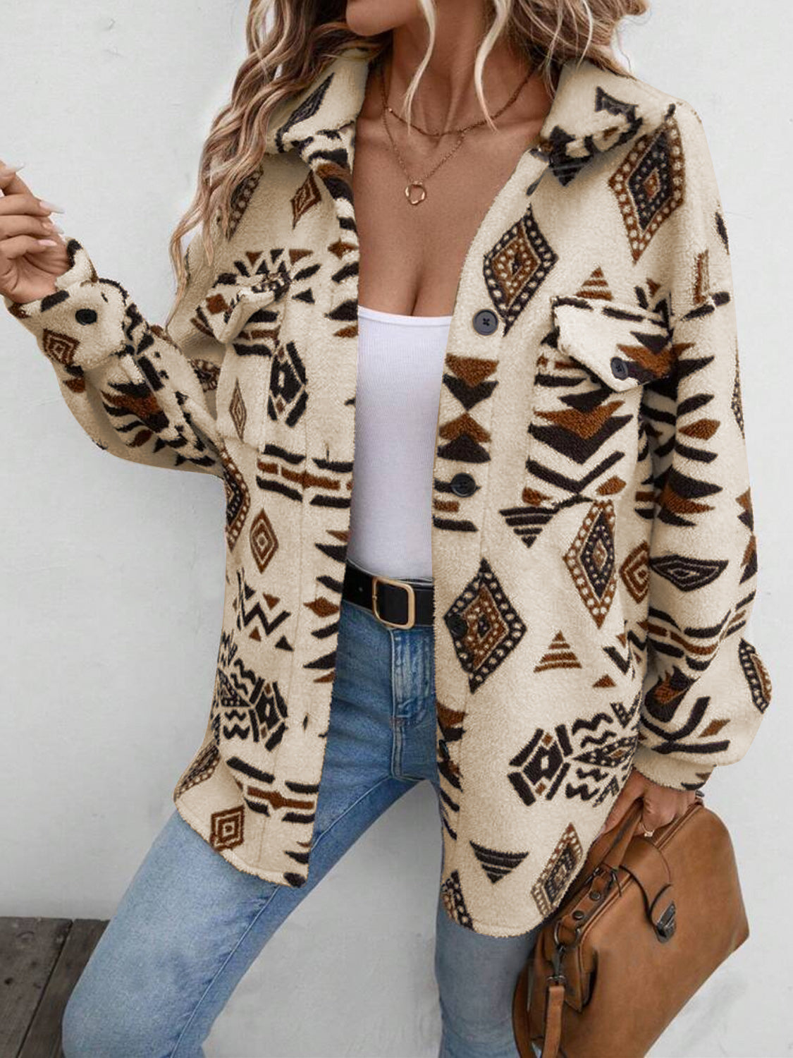 Tan Aztec print sherpa shacket with button front and chest pockets.