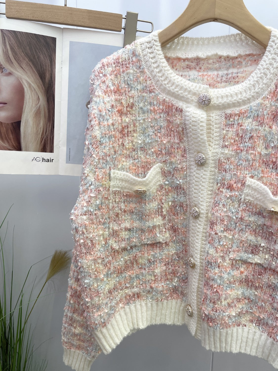 Textured bouclé knit cardigan in multi-color with jewel buttons and patch pockets.