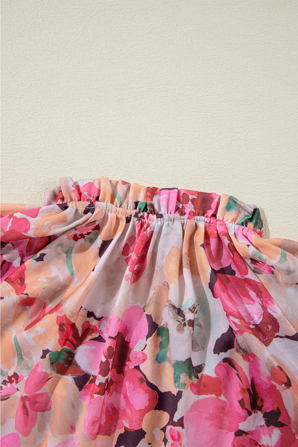 Pink floral print blouse with ruffled yoke detail