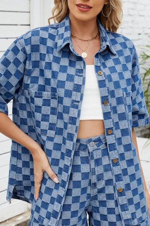 Boxy denim shirt in medium blue checkered pattern with button front and chest pockets.