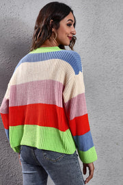Rainbow block button-down knit cardigan in acrylic with bold stripes of neon green, red, pink, cream, and blue.