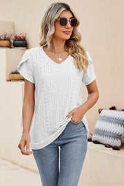 White eyelet knit top with short sleeves and V-neck, featuring perforated sleeve detail.