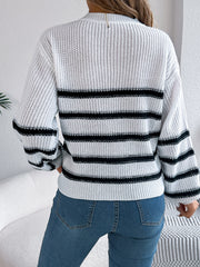 White knit sweater with black horizontal stripes and ribbed details.