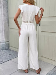 White lace-trimmed wide-leg romper with flutter sleeves and cutout waist detail