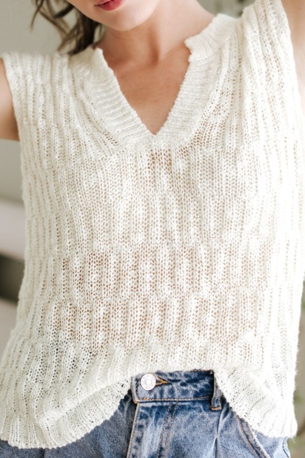 Beige textured knit V-neck shell top with a relaxed fit.