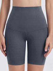 Charcoal high-waist bike shorts with a seamless contour fit and v-seam detail.