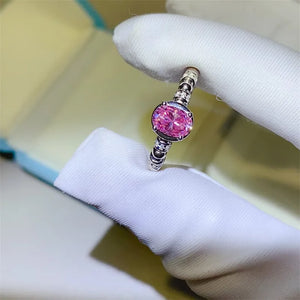 Silver ring with oval pink moissanite and beaded band
