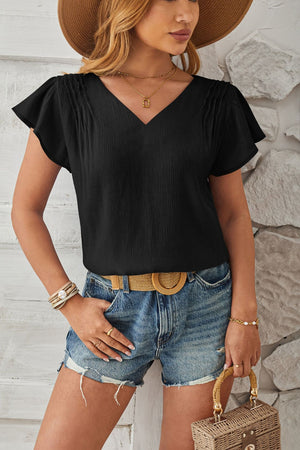 Black textured V-neck blouse with pleated flutter sleeves.