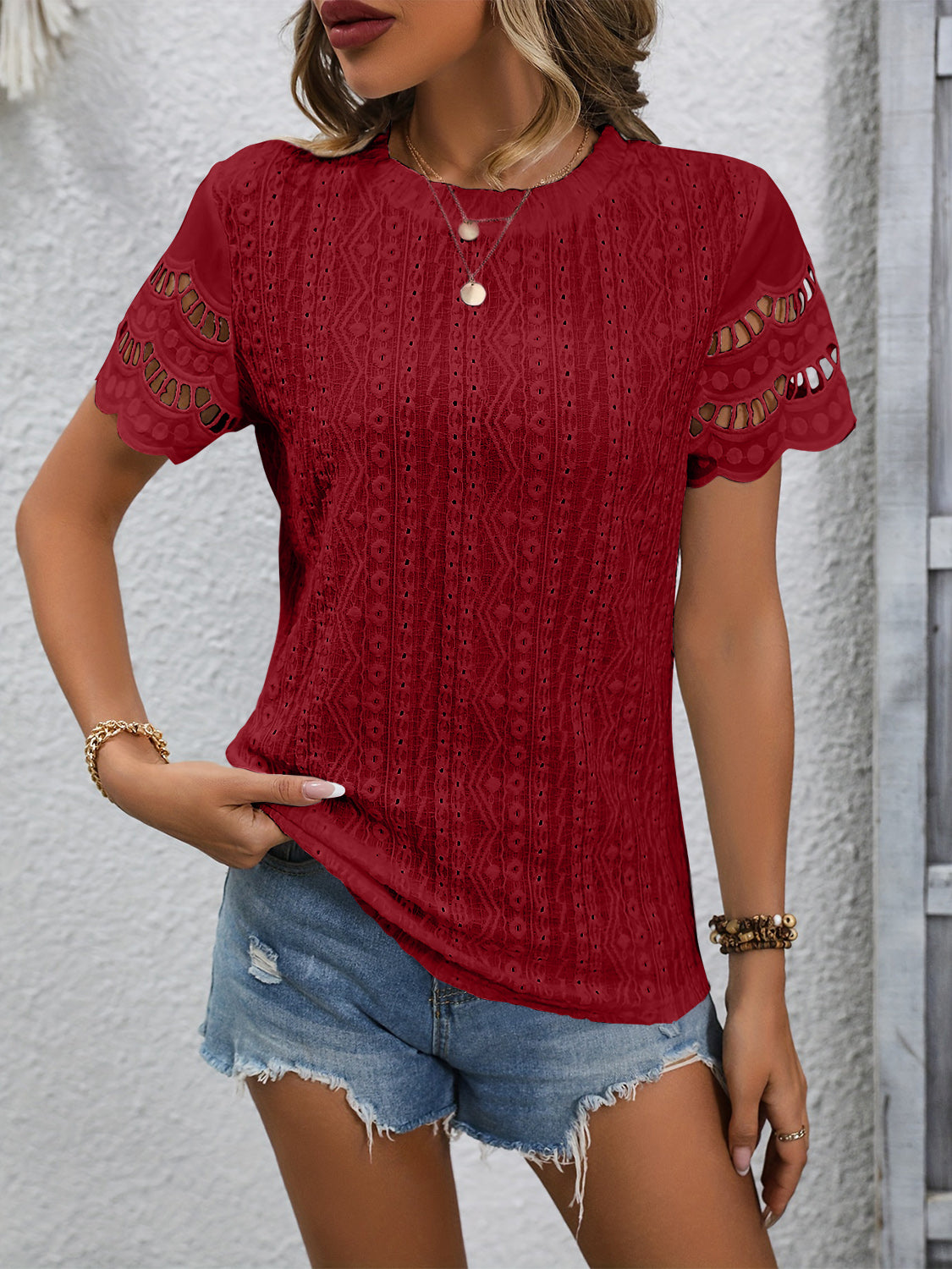 Burgundy eyelet blouse with scalloped short sleeves and a detailed lace pattern.