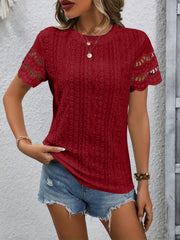 Burgundy eyelet blouse with scalloped short sleeves and a detailed lace pattern.