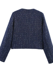Dark blue cropped tweed jacket with metallic threads and a round neckline.