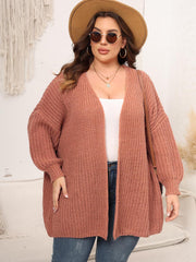 Chunky knit cardigan in coral with balloon sleeves and open front.