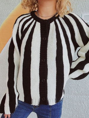 Bold stripe knit cardigan with button front in black and white acrylic.