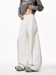 Light gray wide-leg drawstring sweatpants with contrast stitching detail.