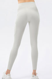 Light gray mesh pocket performance leggings with a high waist.