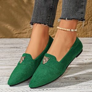 Green slip-on flats with pointed toe and animal head embellishment