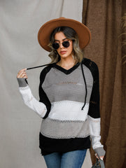 Colorblock eyelet knit hoodie with V-neck and drawstring, featuring black, grey, and white stripes.