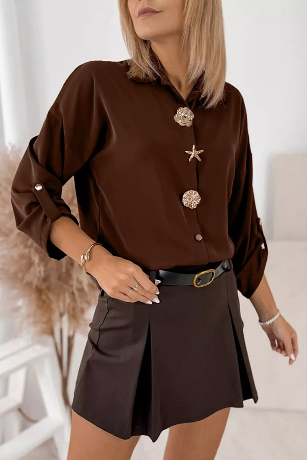 dark brown button-up shirt with hip-length and button-front