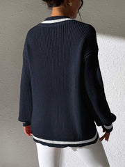 Dark navy knit sweater with white stripe trim at V-neck and hem.