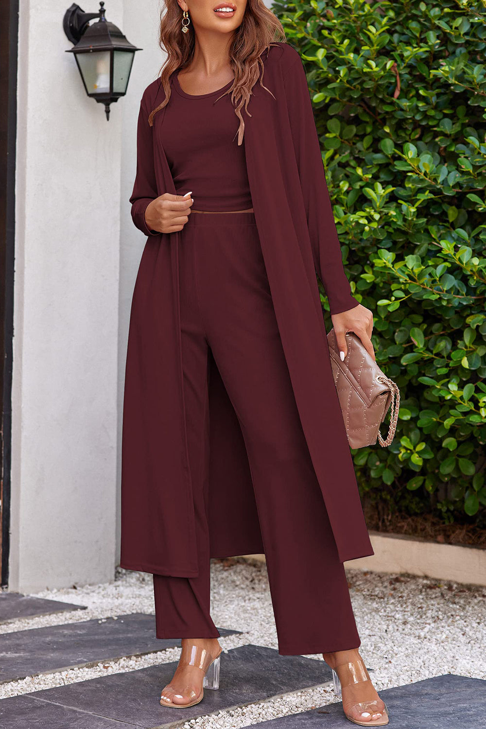 Burgundy ribbed knit duster and lounge set with wide leg pants and a cropped top.