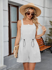 Light gray square-neckline romper with drawstring waist and shorts.