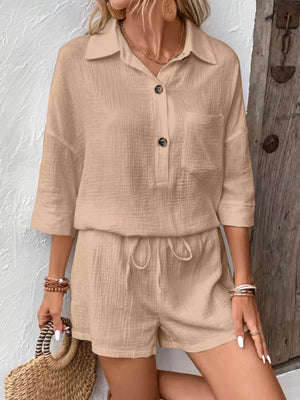 Khaki cotton two-piece set with button-up shirt and drawstring shorts.