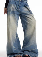 Men's wide leg blue washed jeans with a baggy fit and gradient fade detail.