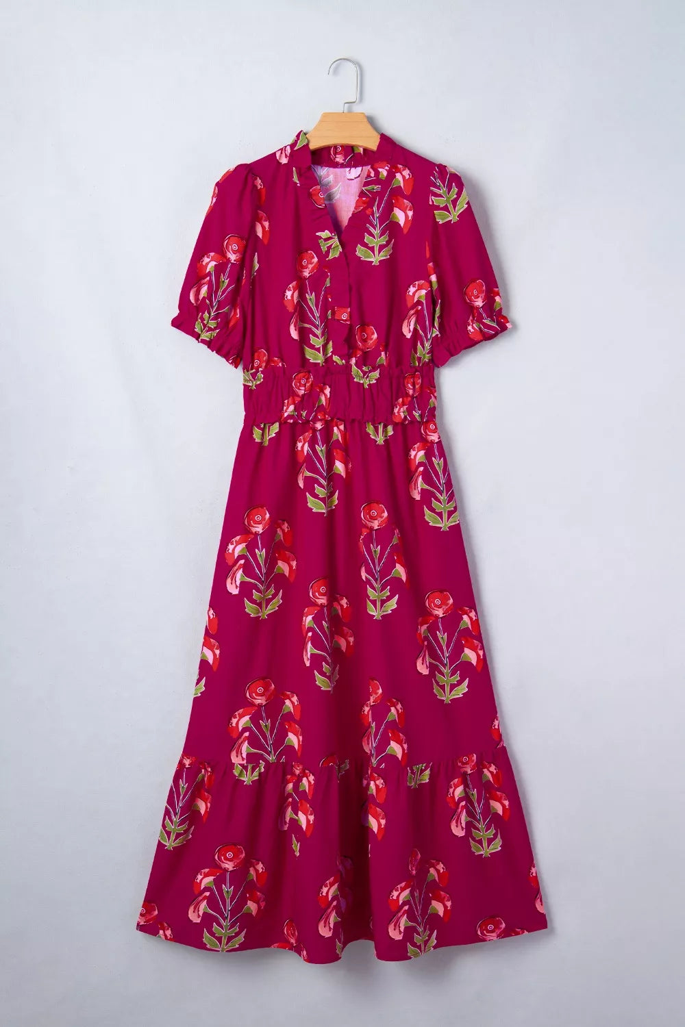 Charming floral tiered midi dress in magenta with red floral print, V-neck, short sleeves, and smocked waist.