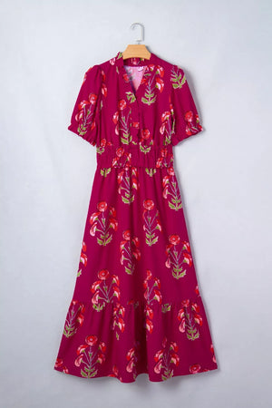 Charming floral tiered midi dress in magenta with red floral print, V-neck, short sleeves, and smocked waist.