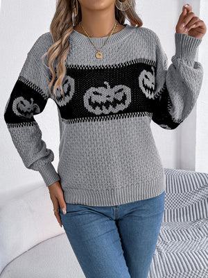 Gray acrylic knit sweater with jack-o'-lantern intarsia pattern, crew neck, and long sleeves.