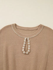 Ribbed knit sweater dress in tan with pearl-adorned keyhole neckline detail.