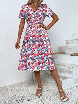 Vibrant floral print midi dress with V-neck, short sleeves, and elastic waist.