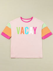 Colorblock graphic tee in pink with "VACAY" text and multi-colored sleeves.